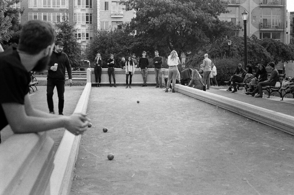 a group of people playing a game of ping pong